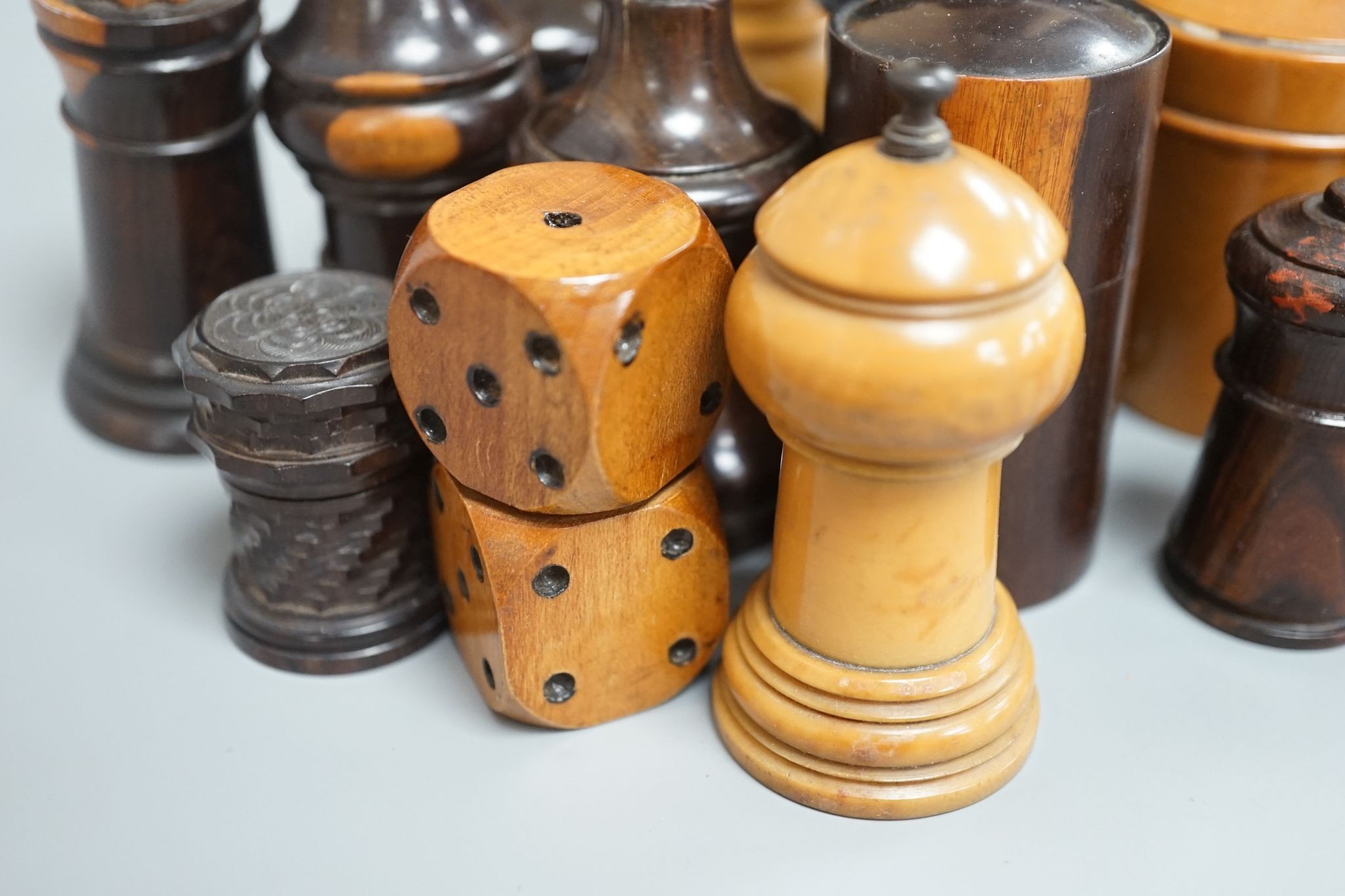 Nine Victorian turned or carved treen match holders with ‘go to bed’ finials, a treen double measure, cased glass measure and engine turned container (13)
